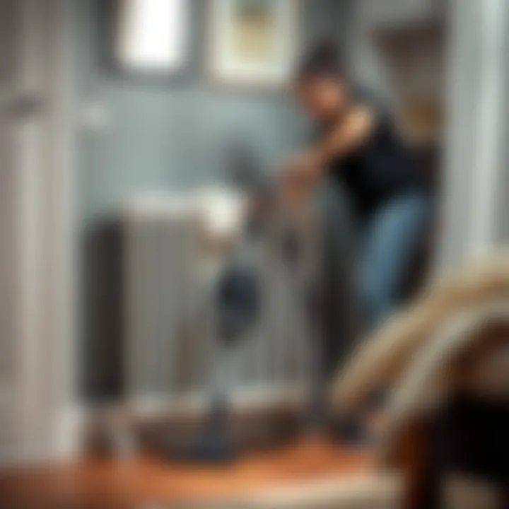 A person using a vacuum to clean a radiator