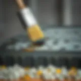 A close-up view of an oil-coated metal surface ready for painting