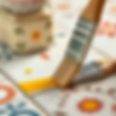 Close-up of brush applying paint to tile surface